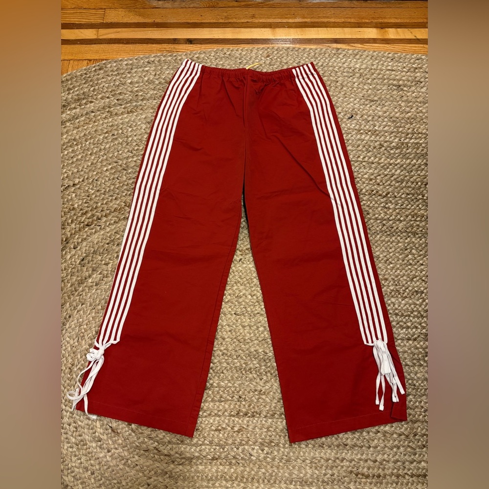 Red Track pants with white stripes & ties at the end